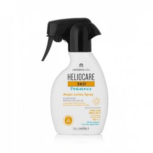 Heliocare - pediatrics atopic lotion spray. A white bottle with a black spray cap and Heliocare branding.